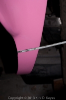 Behind rear wheel