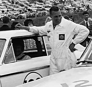 Brian Muir started with the John Willment Organization as a mechanic. He is seen here with Jack Sears who is preparing to drive the Willment Ford Galalxie at Brands Hatch on Aug. 5, 1963. Photo courtesy of Ford Motor Company.